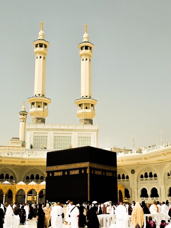 A stunning view of Kaaba surrounded by pilgrims at Masjid al-Haram in Mecca.